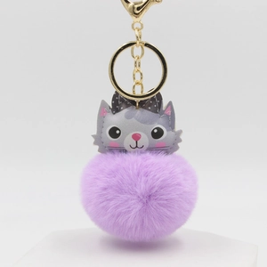 Cute lavender pompom keychain with a grey cat head charm and elegant gold hardware