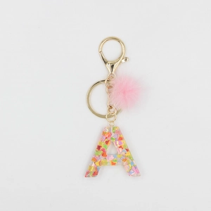 Porte-clés pompon rose avec lettre A en résine et paillettes colorées en cœur
