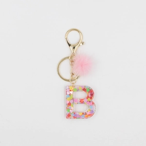 Porte-clés lettre B en résine colorée avec paillettes et pompon en peluche rose