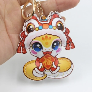Cartoon leather snake keychain with lion dance hat and Fu sign on golden ring