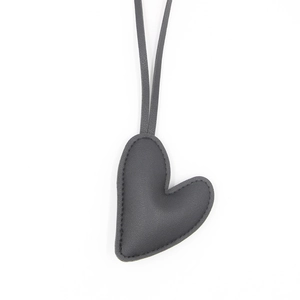 Dark gray heart leather keychain with refined texture and durable stitching for bags