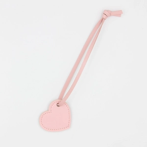 Pink heart-shaped leather keychain with matching strap on a clean white background