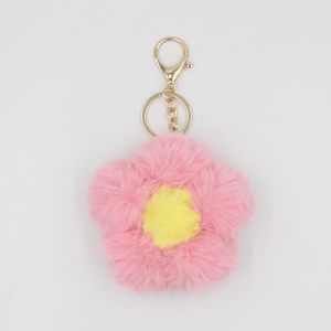 Porte-clés fleur de tournesol en fourrure rose avec centre jaune et fermoir doré