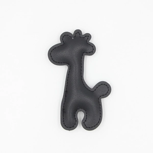 Minimalist black PU leather giraffe keychain pendant with elegant stitching detail