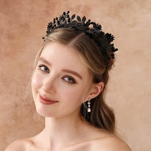 Detailed view of Gothic black crystal headband and matching pearl teardrop earrings