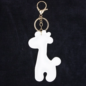 Detail of white PU leather giraffe keychain with golden metal lobster clasp and ring