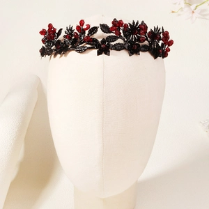 Detail of Gothic headband with black metal leaves and dark red crystal beads for Halloween