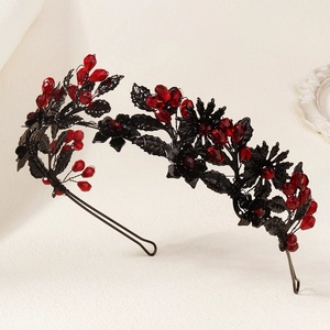 Detail of gothic crown with black leaves and deep red faceted crystal beads on wire