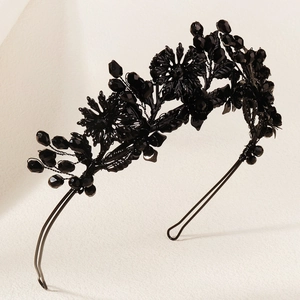 Detailed side view of handmade black crystal beaded headband with Gothic floral accents