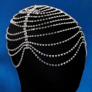 Close-up of Bohemian silver rhinestone headpiece with layered tassels and crystal mesh