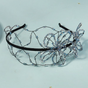 Close-up of handmade crystal beaded butterfly headband with blue iridescent sparkles