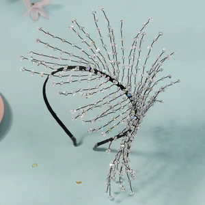 Close-up of handmade crystal beaded headband with intricate branch-like wire structure