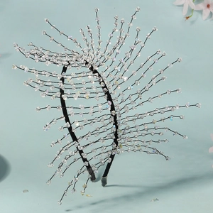 Close-up of handmade luxury crystal beaded headband with mesh woven wire details