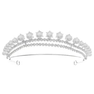 Close-up of silver bridal tiara with elegant white pearls and sparkling rhinestones