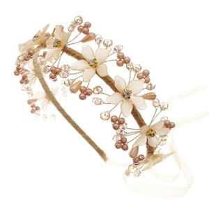 Detail of handmade champagne fabric flowers with crystal centers and pearl beads