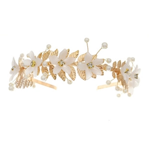 Detailed view of handmade bridal headband with white flowers, pearls and golden wheat ears