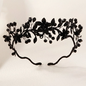 Detail view of gothic black floral crown with crystal beads for Halloween parties
