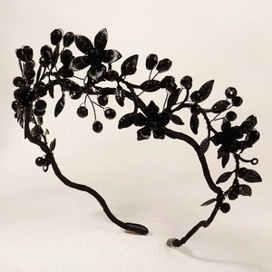 Close-up of black floral gothic crown with beaded vine details for Halloween parties