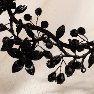 Detail of gothic black floral crown with crystals and handmade wire-wrapped petals