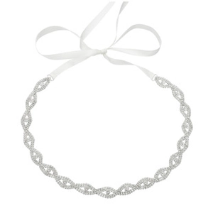 Detail showing bridal belt with rhinestone leaf pattern and white satin ribbon bow
