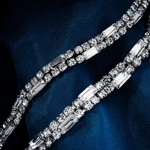 Macro detail of bridal rhinestone belt with sparkling square and round crystal settings