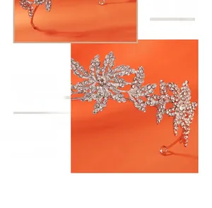 Close-up detail of silver bridal crown featuring intricate floral and leaf rhinestone designs