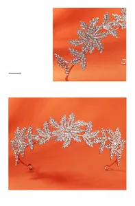 Close-up of handmade silver bridal crown featuring leaf motifs and sparkling rhinestones