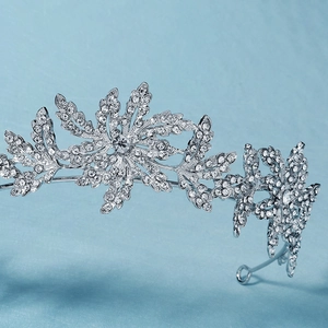 Silver bridal tiara with floral leaf design and sparkling rhinestones for weddings