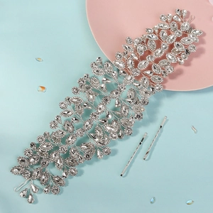 Detailed view of silver bridal hairpiece with vine design and marquise cut rhinestones