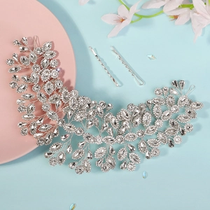 Close-up of handmade bridal headband with silver flowers and crystal rhinestones