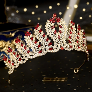 Detailed view of luxury vintage crown with red gems and crystal rhinestones
