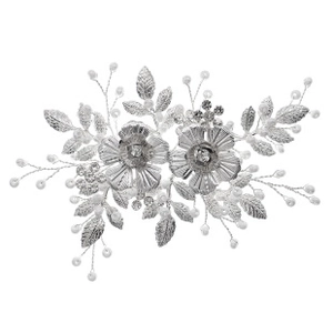 Detail of silver floral hairpiece with crystal stamens and white pearl accents
