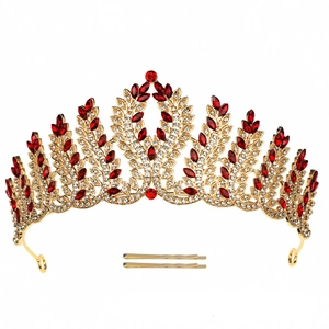 Luxurious vintage gold feather crown with red gemstones and crystals for bridal hair