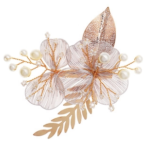 Close-up of handmade bridal hair clip with gold wire, pearls, and mesh flower petals