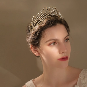 Luxurious bridal tiara with sparkling crystal zircons worn by a model in soft lighting