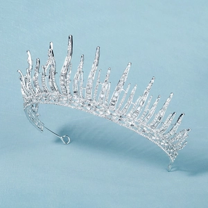 Macro detail of silver bridal tiara featuring spiked crystal ice design and rhinestones