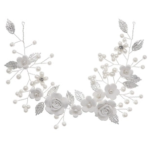 Detail of handmade resin flower hair clip with pearl beads and silver leaf vine design
