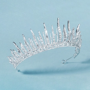 Detailed macro view of silver bridal crown featuring crystal ice-spike design for weddings
