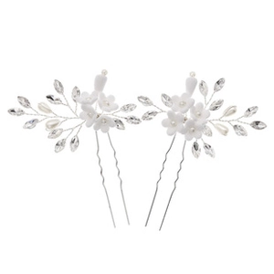 Detail of handmade white flower hair pins with crystal beads and pearls for bridal styling