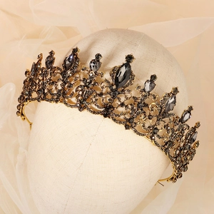 Vintage black crystal bridal tiara with antique gold alloy and rhinestones on a mannequin