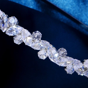 Macro detail of luxury marquise and round cut zircon stones on a silver hairband