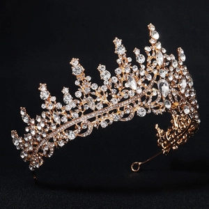 Luxury gold bridal crown with sparkling crystal rhinestones on a black background