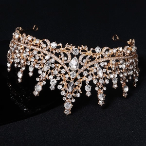 Luxury vintage gold bridal crown with drop-shaped rhinestones on black background