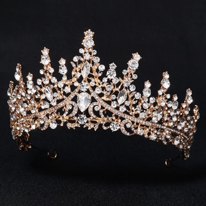 Detailed macro view of luxurious gold bridal crown with shimmering pear-cut crystal rhinestones