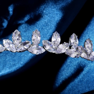 Detailed close-up of marquise-cut zircon stones on a silver-polished luxury headband