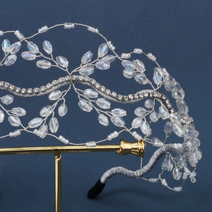 Detail view of handmade silver mesh headband with crystal beads and sparkling rhinestones