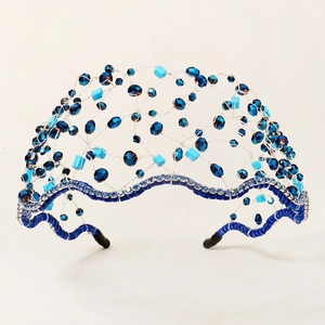 Close-up of handmade mesh crown with deep blue crystals and silver wire details