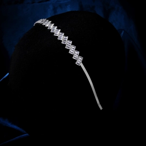 Macro shot of sparkling rectangular zirconia on a slim silver-tone wedding headband