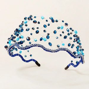 Detail of blue crystal beads and handcrafted mesh weaving on a high-quality headband