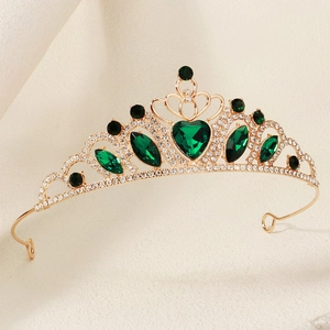 Elegant gold princess crown with green heart gemstones and white rhinestones for parties